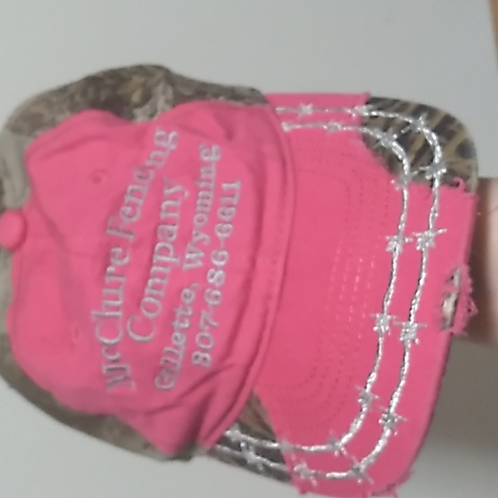 Women's camouflage, pink, and silver cap.